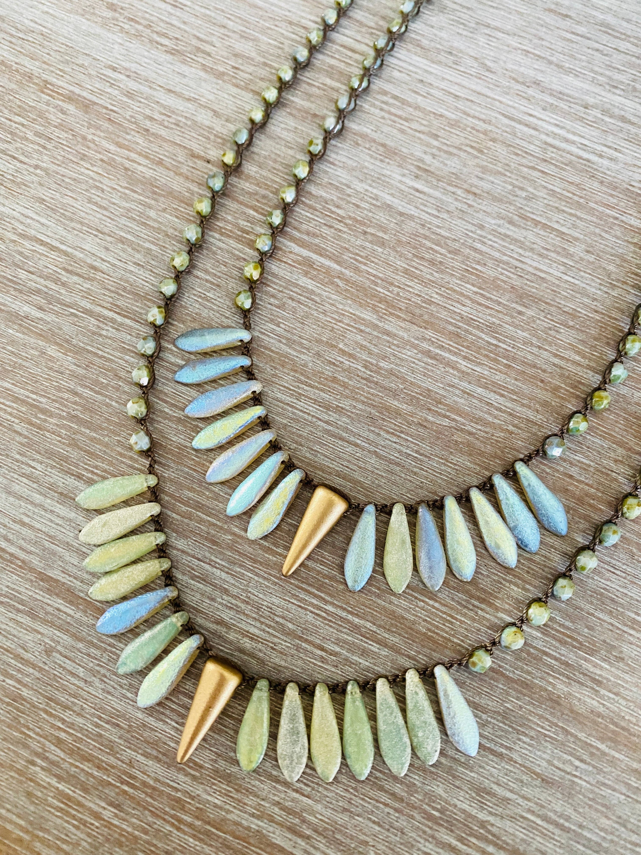 Thorn and Dagger Knotted Crystal Necklace In Etched Shimmer